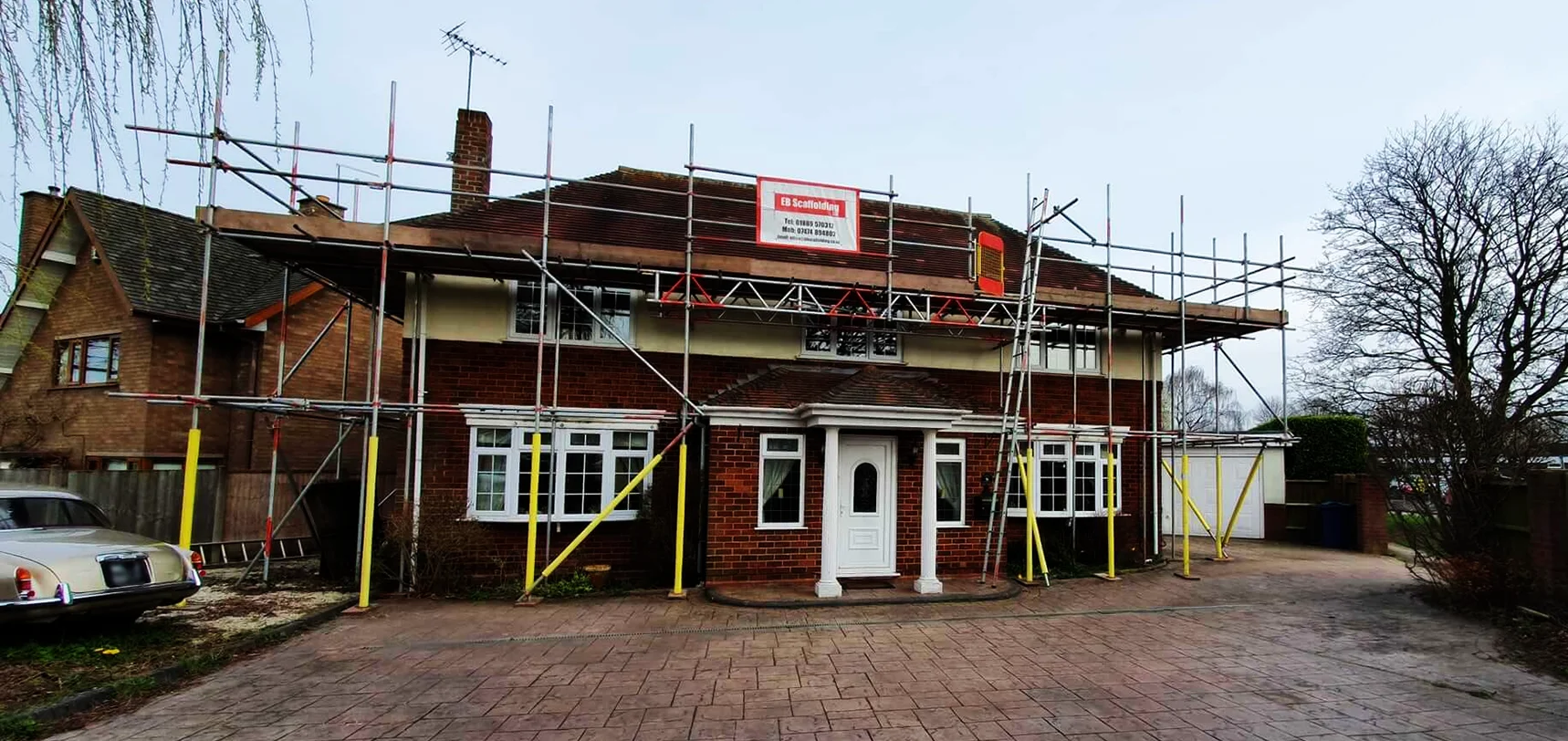 EB Scaffolding scaffold around the front of a detached brick house